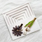 گیره مو وارداتی طرح بابونه و لاله بسته 2 عددی - Image 2